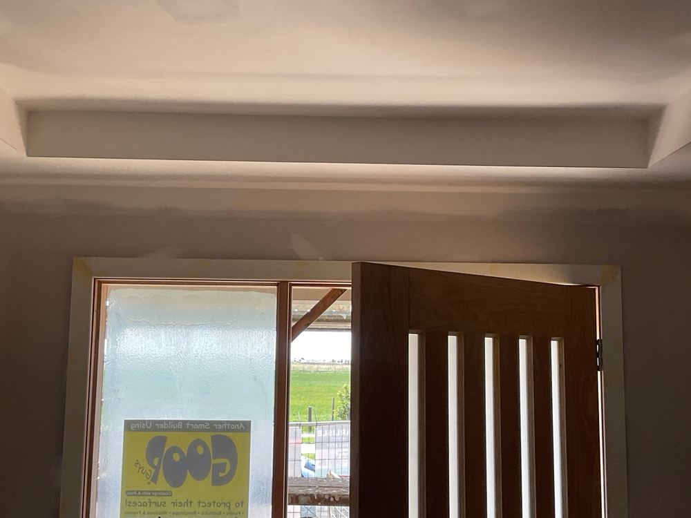 Wall bowing more than 5mm under a 1.8m straight edge, found during a fixing inspection in Strathtulloh
