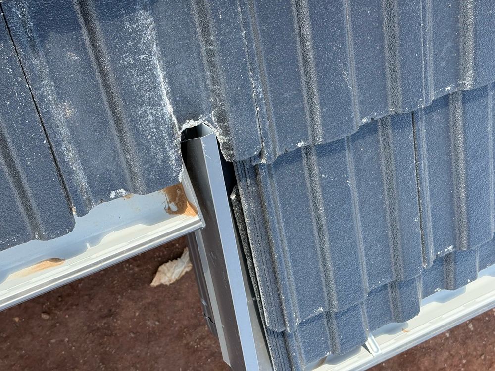Poorly finished flashing junction that is unlikely to keep water out long term, found during a pre-handover inspection in Strathtulloh