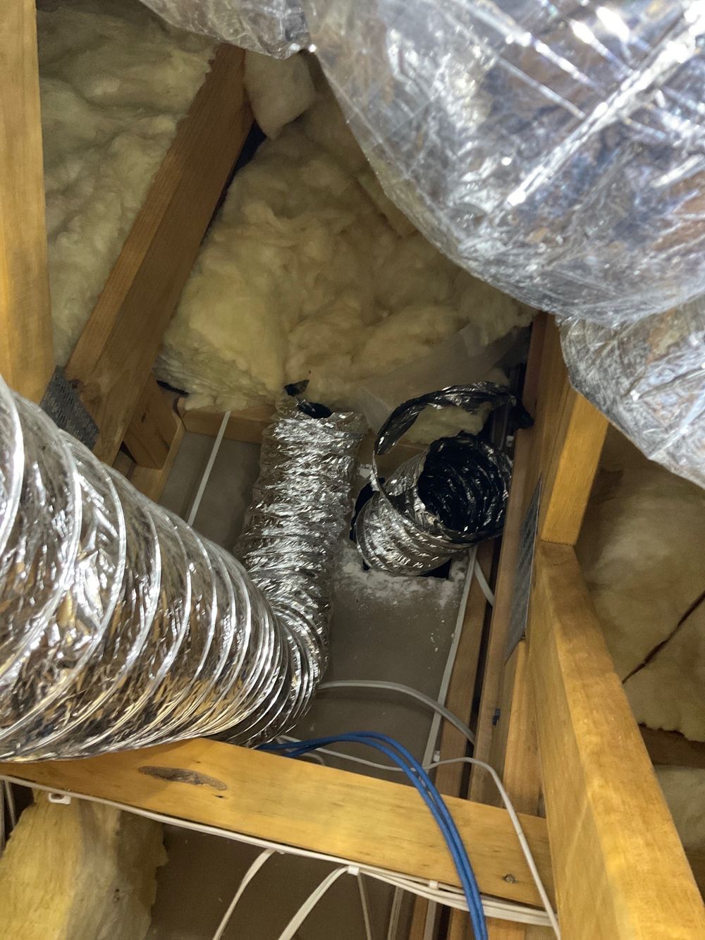 Rangehood not ducted outside under a sarked roof, inviting mould in the ceiling, found during a pre-handover inspection in Strathtulloh