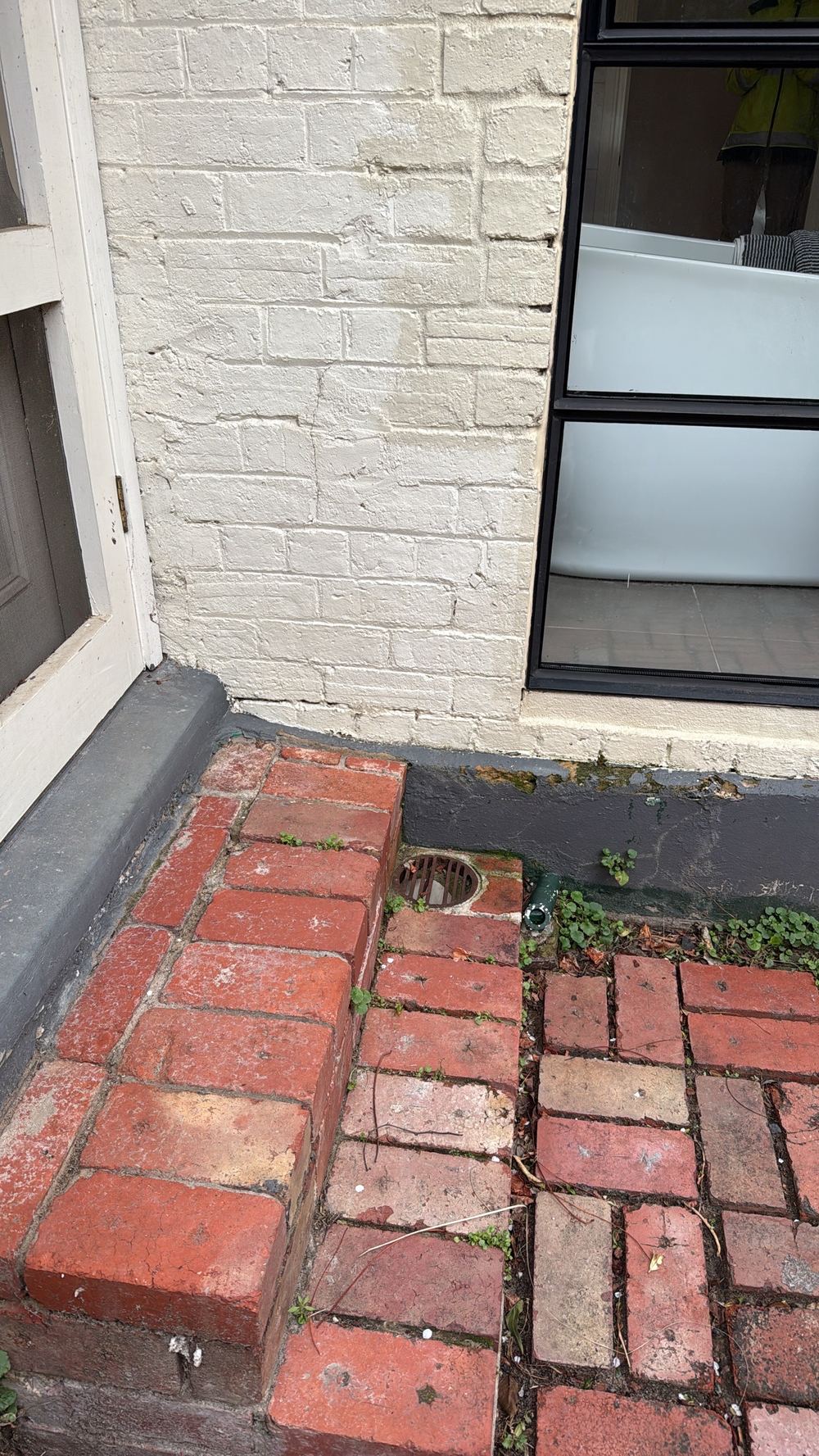 Salt staining on lower brickwork from rising damp, found during a pre-purchase inspection in Hawthorn