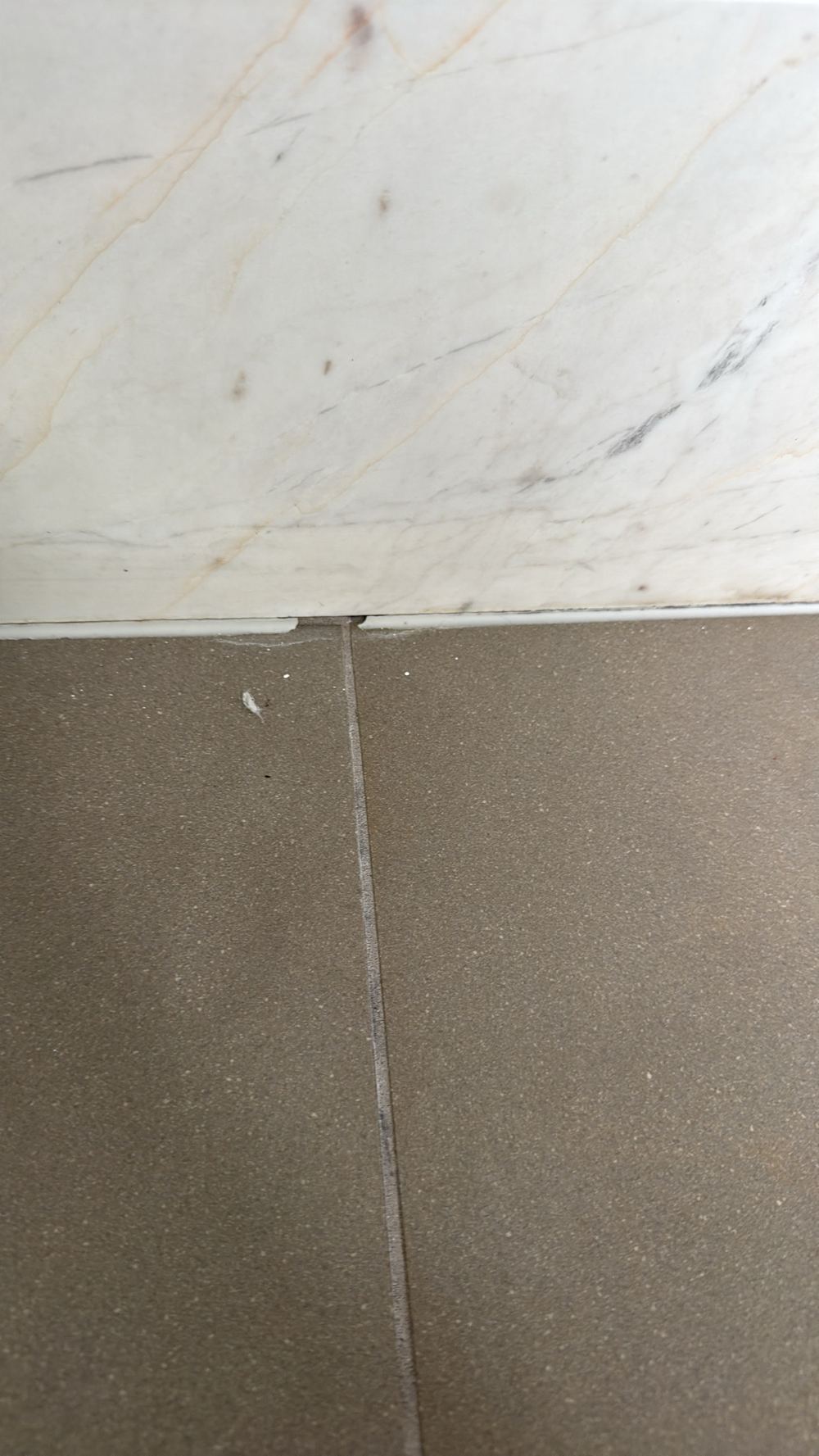Perished sealant with gaps that let moisture into the wall, found during a pre-purchase inspection in Hawthorn